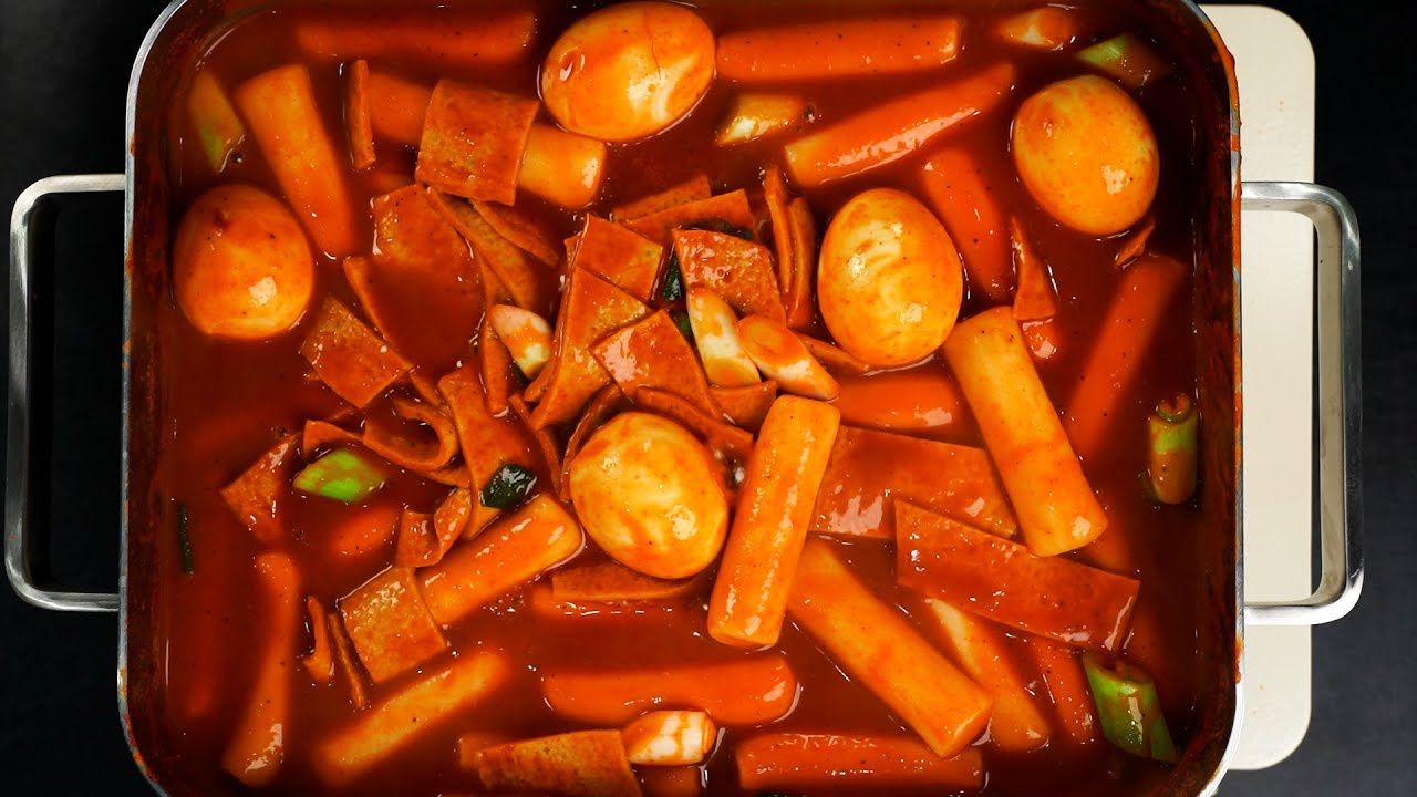 Tteokbokki - Korean spicy rice cake street food in a pan with red sauce
